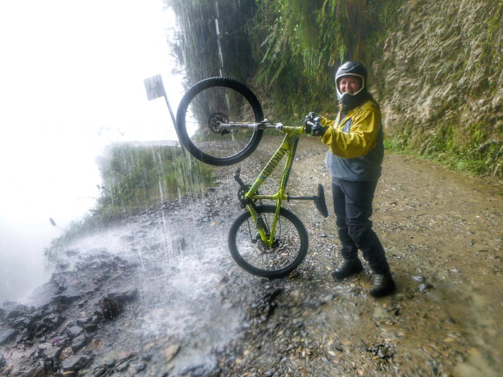 Bonnie with a bicycle on Death Road in Bolivia