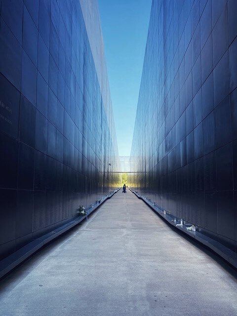 Looking down the long black hallway that lists the victims of communist terror