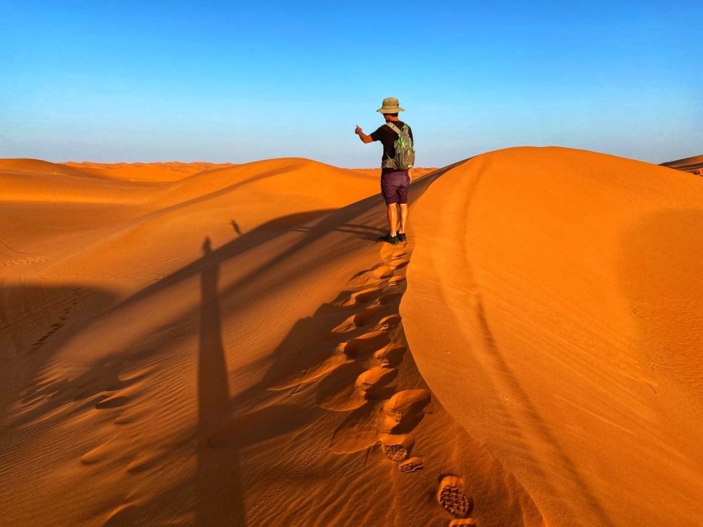 Trin pointing to the next dune we should climb